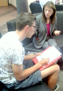 President Diana Doyle speaks with JOU 105 student Ibro Osmanovic during visit to ACCs Parker campus.