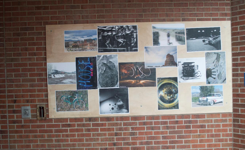 Wheat pastings of Digital Photography students' artwork is displayed around the Art & Design Center.