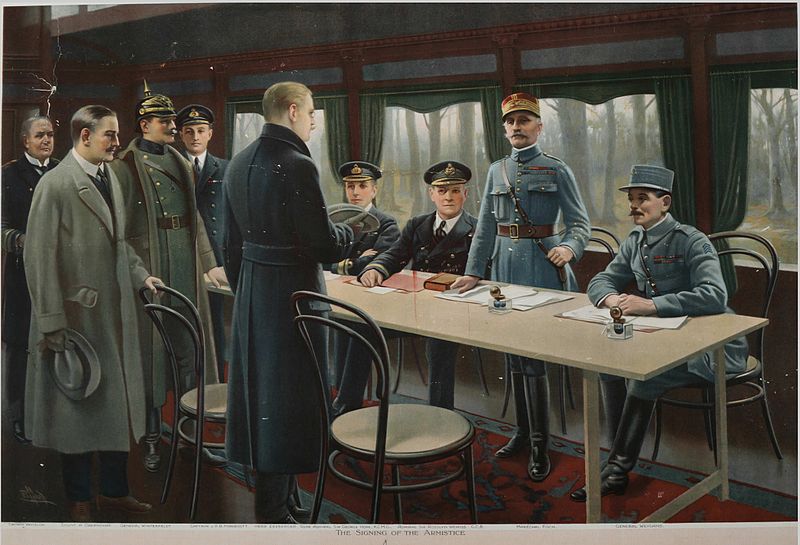 Signing of the November 11, 1918, armistice. Seated from right: General Weygard (FR), Generalissime Foch (FR) (standing), Admiral Rosslyn Wemyss (GB), Vice Admiral James Hope (GB). From back left: Captain Vanselow (GER), Count Oberndorf (GER), General Winterfeldt (with spiked helm) (GER), Captain Marriott (GB), and Mattias Erzberger (GER). 