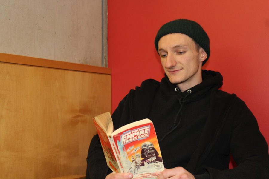 Editor-In-Chief Bryden Smith reading a Star Wars book in the ACC library. Image via Emily Langenberg.
