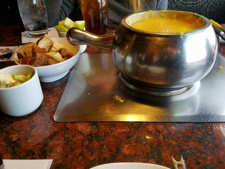 The Wisconsin Cheddar Fondue served with Granny Smith apples, bread and fresh broccoli at The Melting Pot in Littleton, Colo., April 3, 2018.