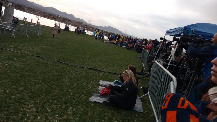 A crowd of supporters and newscasters circle the stage of the Vote for Our Lives rally at Clements Park, Thursday, April 19, 2018, in Littleton, Colo.  