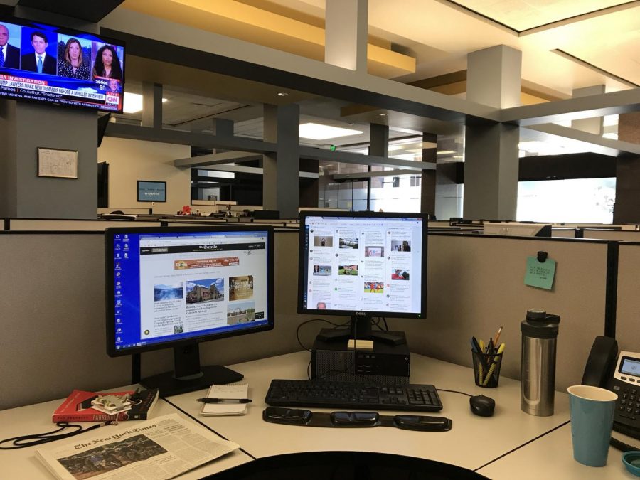 A look at my work station at The Gazette. Having two monitors is essential in order to keep up with the flow of news. So is coffee.