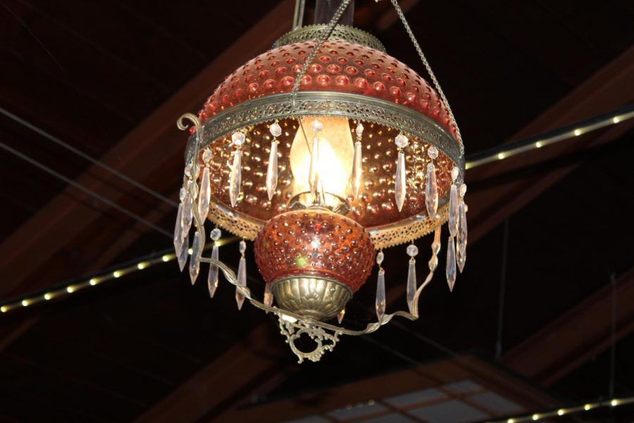 The original chandelier rumored to sway with a phantom breeze.