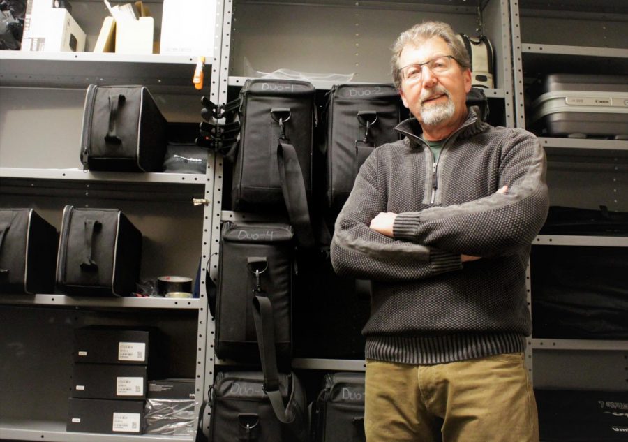 Brad Bartholomew, Head of the photography department at Arapahoe Community College displaying his vast array of camera equipment in the storage closet of the Arts and Design photography building on Feb. 19th 2019.    
  
