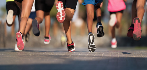 Numerous people running in a group. 