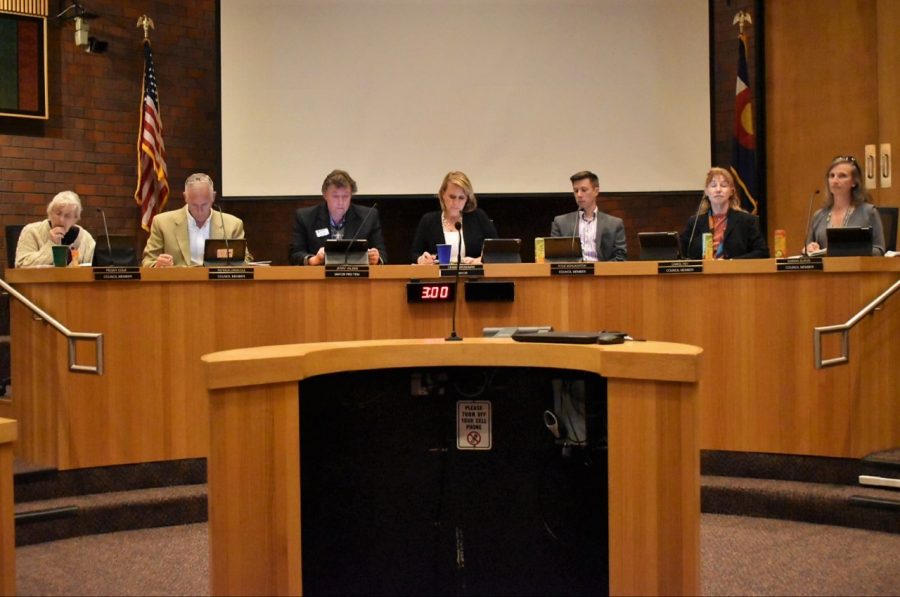 (Left to Right)  Littleton City Council members Peggy Cole, Patrick Driscoll, Jerry Valdes, Debbie Brinkman (middle), Kyle Schlater, Carol Fey and Karina Elrod initiate the April, 15, 2019 meeting in Littleton, Co. 
The meeting addressed drainage, the youth committee and community in Littleton.