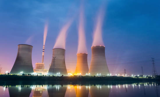 A power plant situated along the Hudson River.