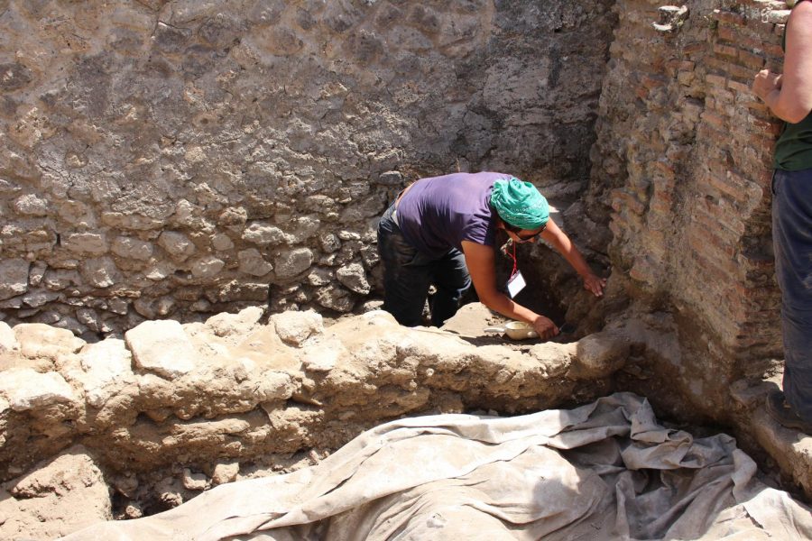 An archeologist works on digging around the ruins of Pompeii. Photo taken on Thursday, June 20, 2019.