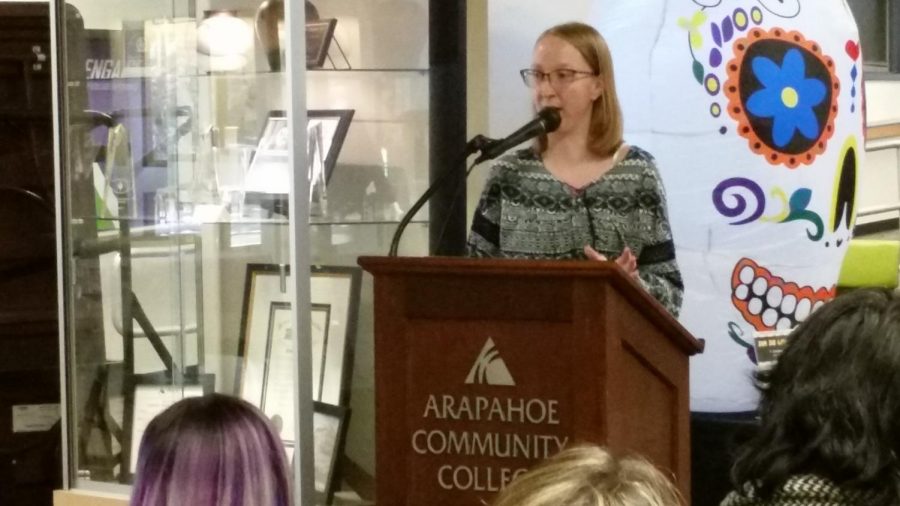 Mckenzie Marner reading her award winning story, Games, to an audience in the student lounge at Arapahoe Community College in Littleton, Colo., on Wednesday, Oct. 2, 2019.