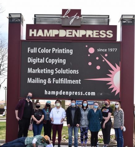 The Progenitor team gathers outside Hampden Press, posing as a group for the first time on April 23, 2021.

Left to right: Connor Sandrock, Kalyca McQuire, Samantha Scanlon, Zachary Vultao, Dalton Giesick, Jocelyn Hodovance, Meagan White, Melissa Morse, Mckenzie Marner.

Front: Professor Jamey Trotter