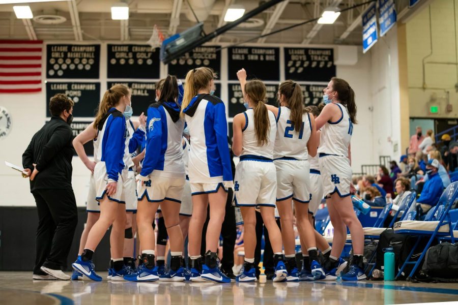 Highlands Ranch Falcons come together as a team during halftime to figure out their game strategy for the second half at Highlands Ranch High School on March 9th, 2021.