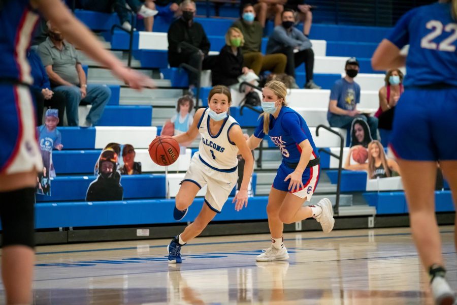 Payton Muma charges for an opening to the basket at Highlands Ranch High School on March 9th, 2021.