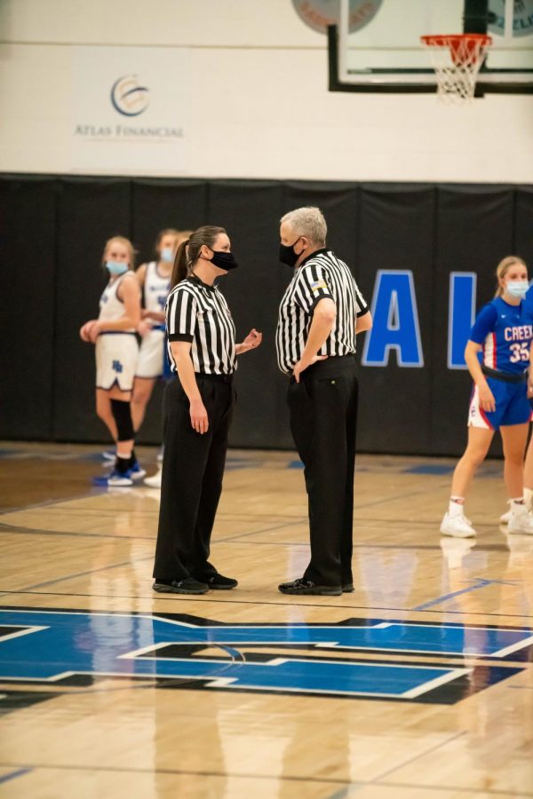 Referees talk about a penalty call made and confer that it was the right call at Highlands Ranch High School on March 9th, 2021.