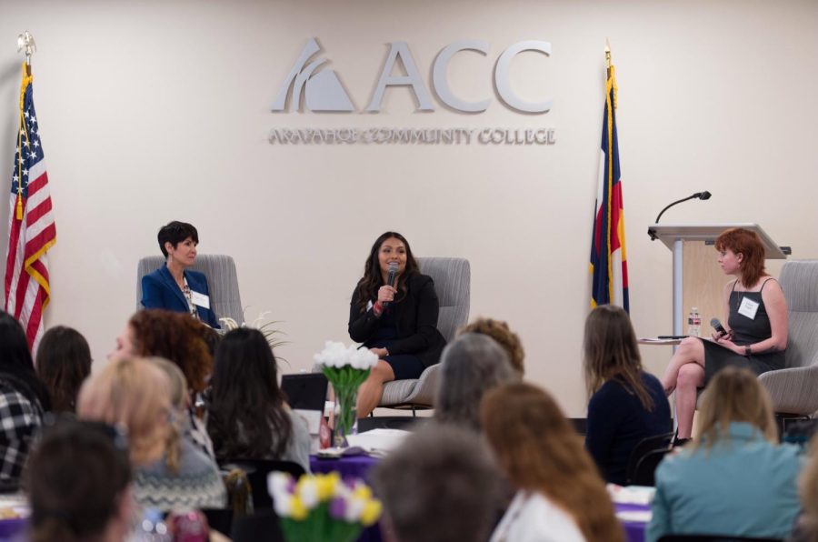 Panelists Kyle Dyer (left) and Andrea Loya (center) onstage with student moderator, Lillian Fuglei (right), at the 2023 Honoring Women in Leadership Luncheon hosted by Arapahoe Community College. Taken March 22, 2023. 