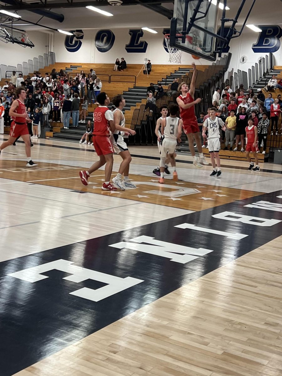 Heritage High School’s Junior guard, Atticus Schroeder (2), finishes a lay-up late in the fourth quarter. 11.28.2023 19:00 