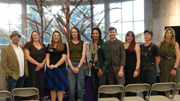 The readers this year included (from left to right): Professor Jamey Trotter, Professor Andrea Mason, Professor Jennifer Jones, Iris Everett, Professor Jomil Ebro, Professor Robert Turek, Professor Monica Fuglei, Fitz Lewis, and Professor Juliet Beckman.