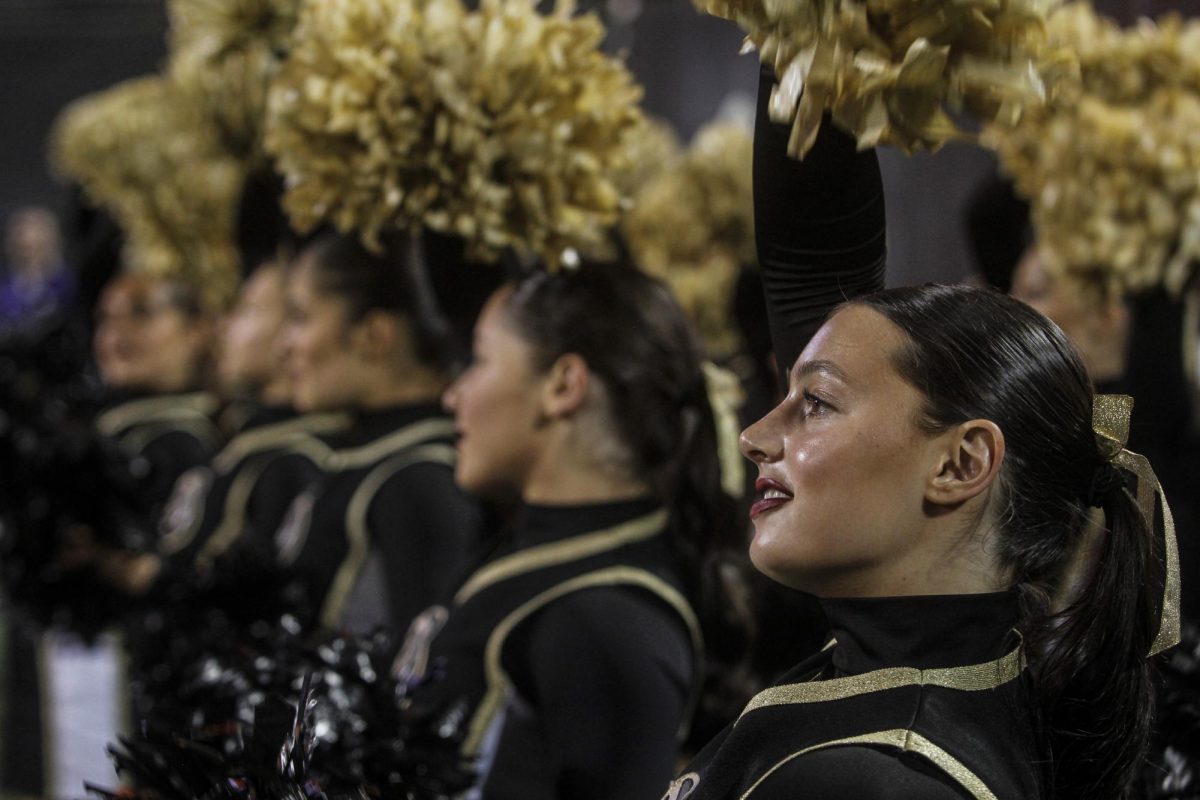 CU cheerleaders chant and support the CU football team during their 31-28 loss to Kansas State on Oct. 12, 2024.