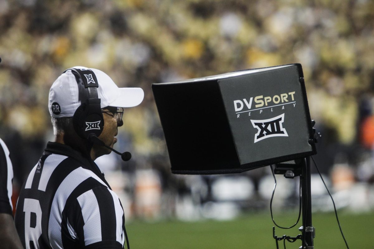 The head official reviews instant replay after a controversial play on third down during CU's 31-28 loss to Kansas State on Oct. 12, 2024.