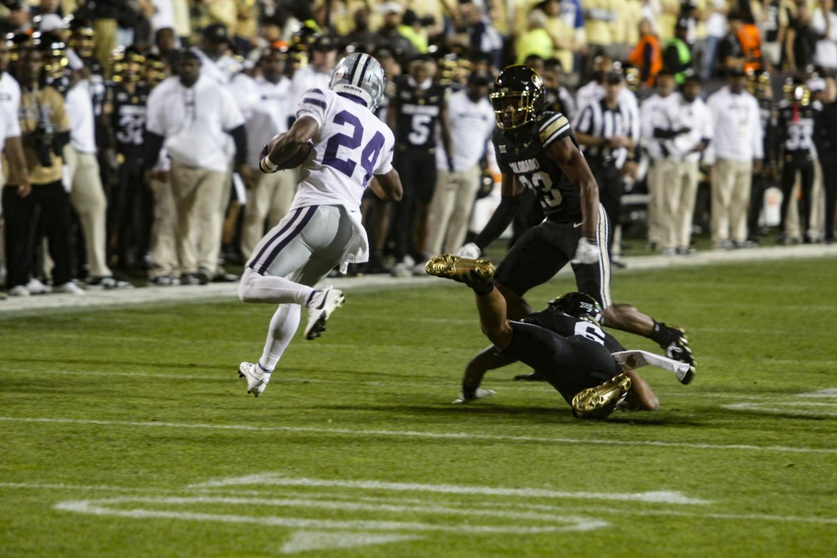 Kansas State, JB Price evades a Colorado defender before being taken down on a play.