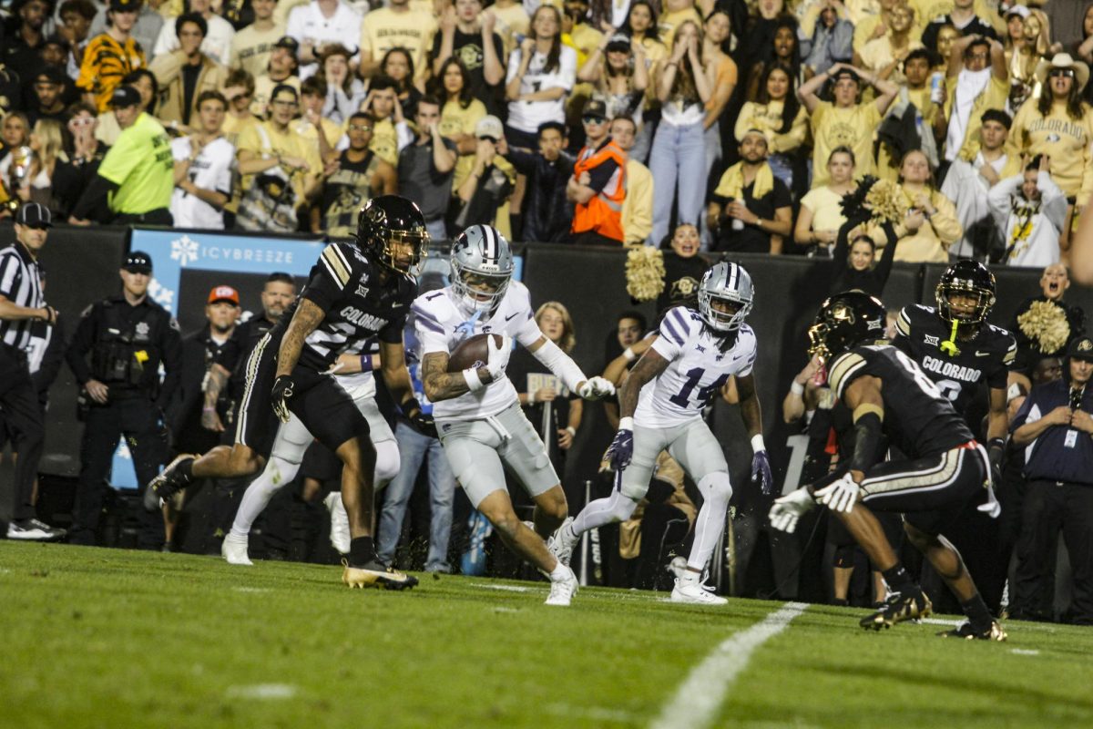 Wide Receiver, Jayce Brown evades a Colorado defender.