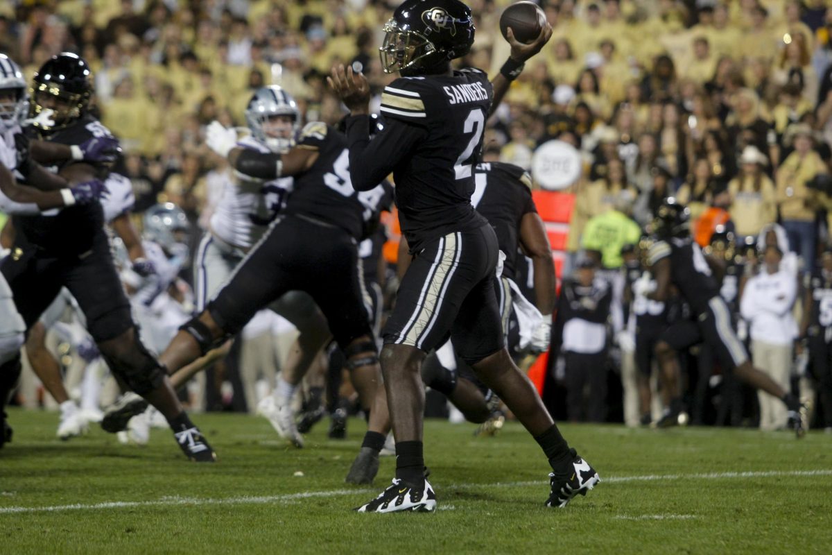 Colorado quarterback Shedeur Sanders passes the football to one of his receivers.