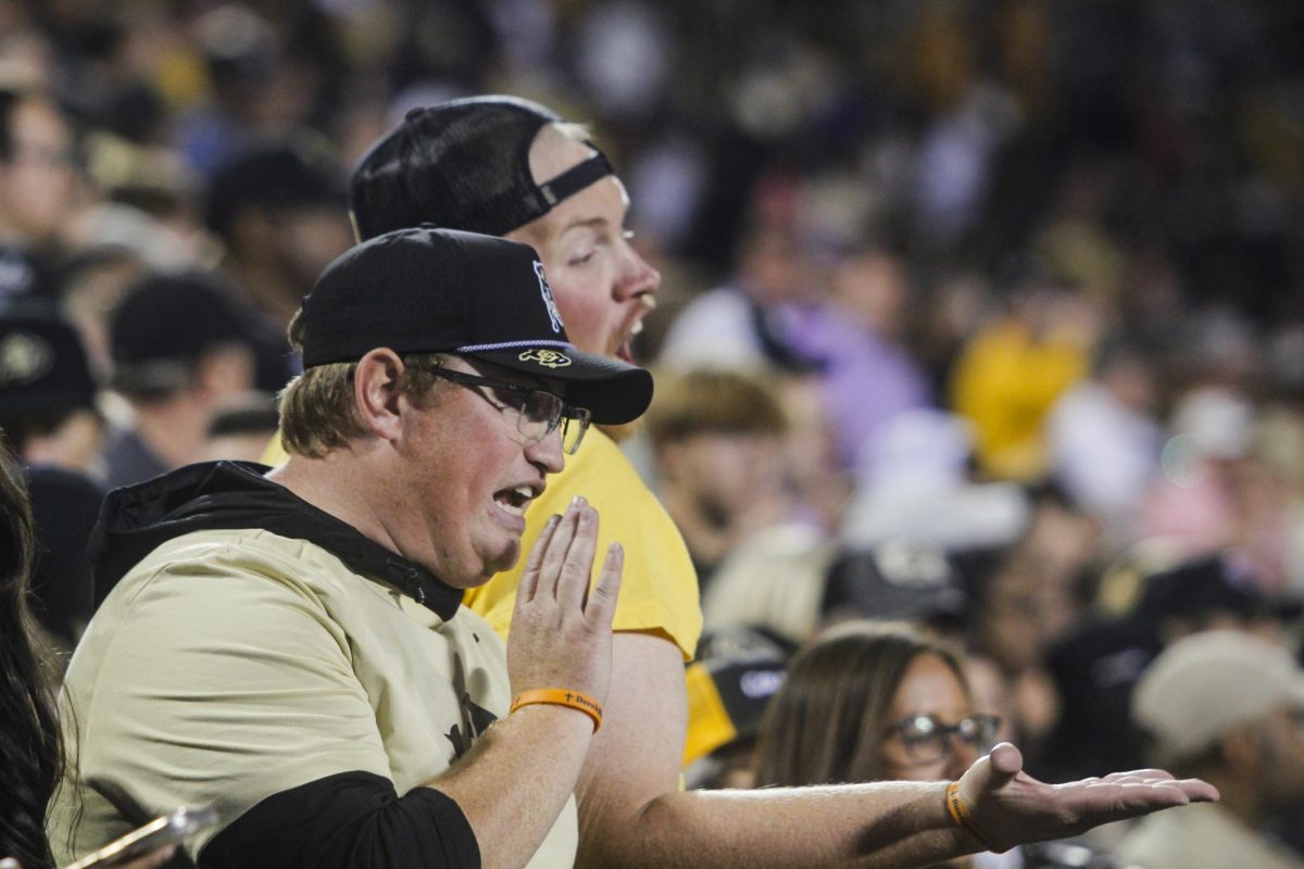 CU fans voice their displeasure over a penalty on the CU offense.