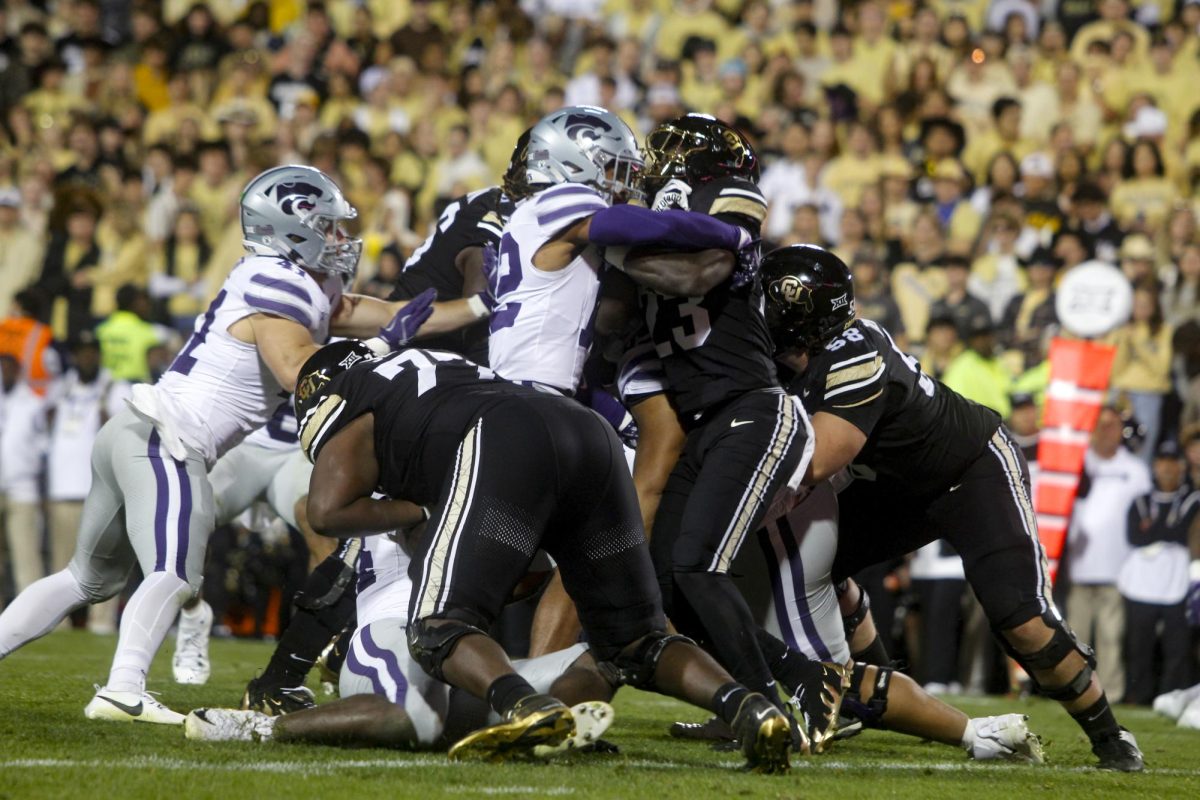 The offensive and defensive lines clash during the matchup between the University of Colorado and Kansas State University on Oct. 12, 2024.