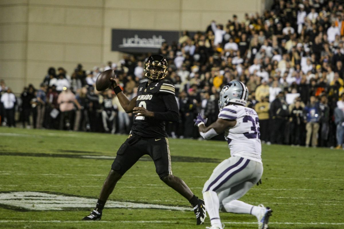 Quarterback, Shedeur Sanders attempts a touchdown pass to one of his wide receivers.