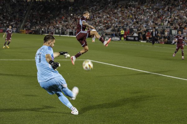 Forward, Rafael Navarro, jumps for the ball as goalkeeper, John McCarthy, kicks the ball from a goal kick spot during the Colorado Rapids 1-3 loss against LA Galaxy.