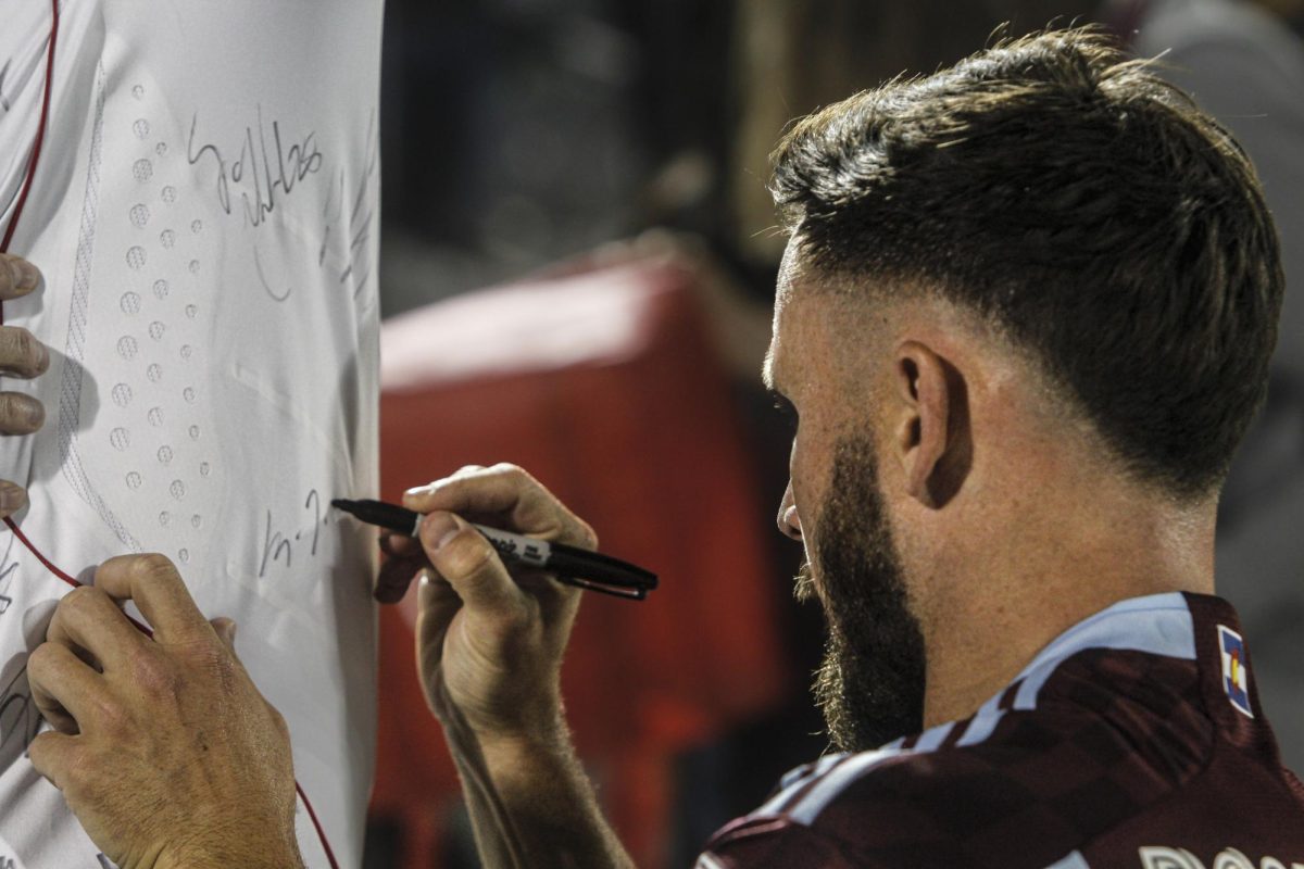 Defender, Keegan Rosenberry signs autographs after the Colorado Rapids 1-3 loss to the Los Angeles Galaxy.