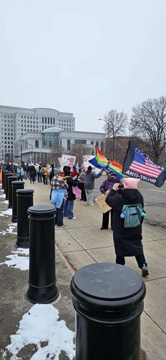 Protestors standing along Broadway Blvd.