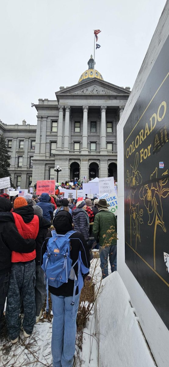 Protestors by "Colorado For All" sign