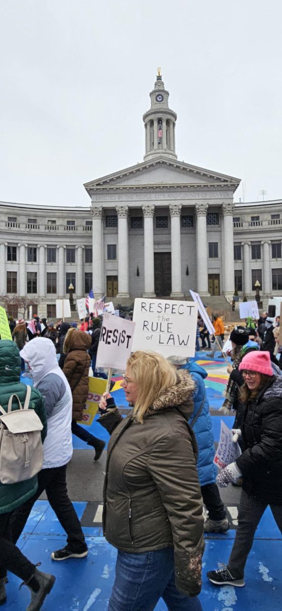 Protestors marching in front of Denver City and County Building