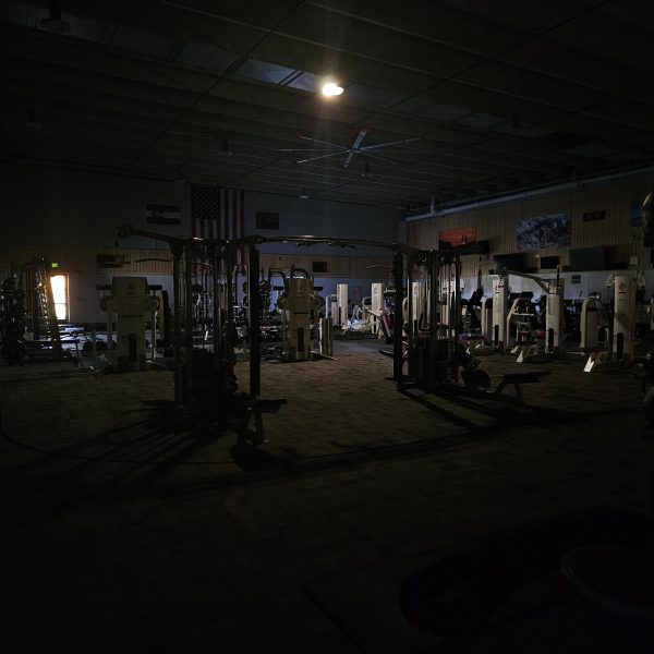 The ACC gym in the Annex Building offers little light to the one person who was still mid-workout.