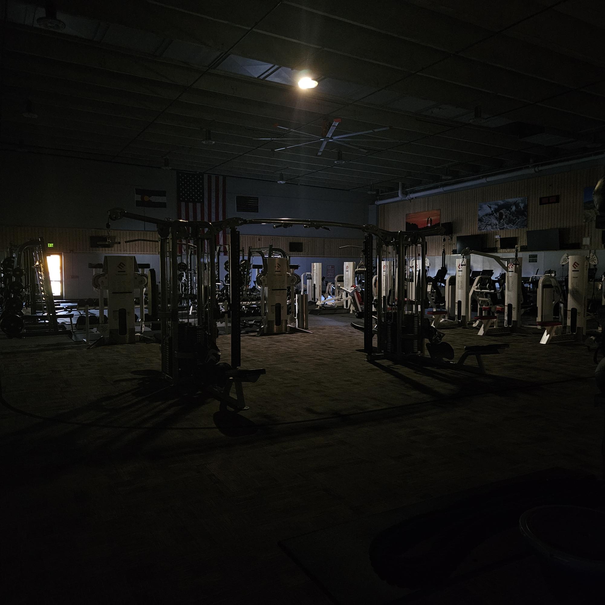 The ACC gym in the Annex Building offers little light to the one person who was still mid-workout.