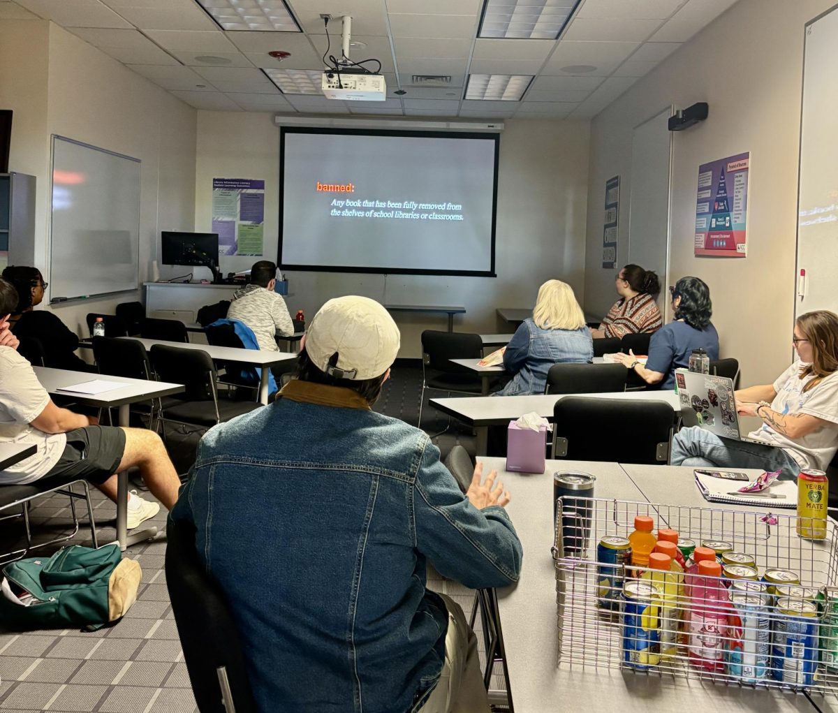 Viewing the documentary in the library classroom. ON-SCREEN: Defining banned for the classification.